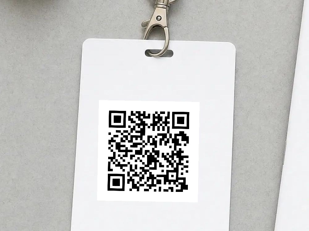 An event badge on a lanyard, carrying the code